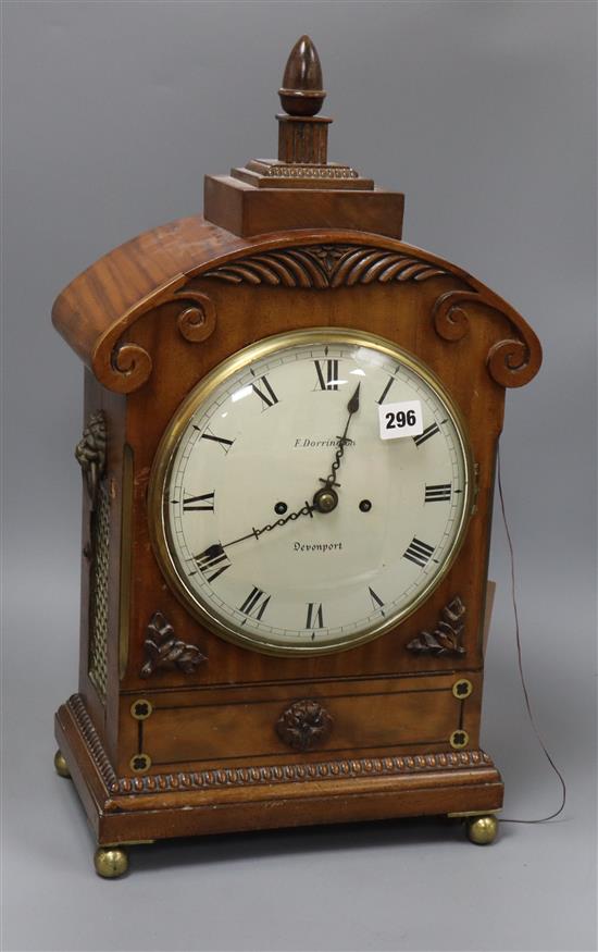 A Victorian carved mahogany mantel clock, F. Dorrington, Devonport, with double fusée repeating movement and painted Arabic dial Height